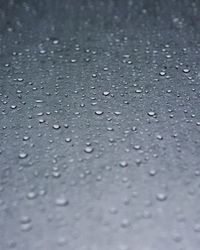 Full frame shot of raindrops on rainy day