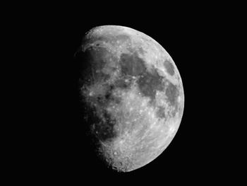 Low angle view of moon against clear sky at night