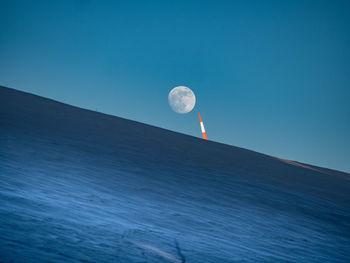 Low angle view of moon against clear sky