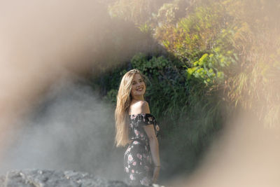 Portrait of woman standing in water