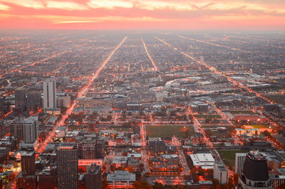 Aerial view of cityscape at sunset