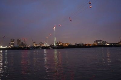 Illuminated city at waterfront