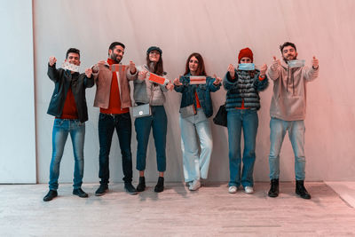 Low angle view of business people standing against wall