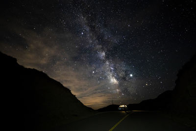 Illuminated road at night