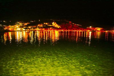 Reflection of illuminated buildings in water