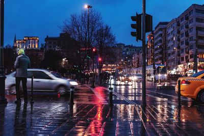 Wet city street during rainy season at night