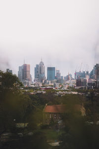 Buildings in city against sky