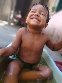 Portrait of smiling boy in water