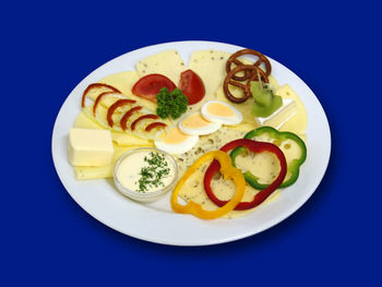 High angle view of food in plate on blue table