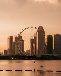 Modern buildings in city at sunset