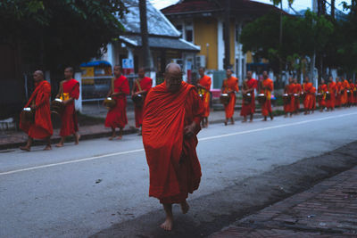 Rear view of men walking in temple