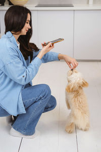 Side view of woman using mobile phone