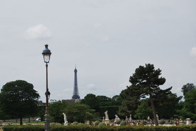 View of tower in park against cloudy sky
