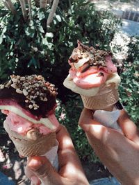 Close-up of hand holding ice cream cone