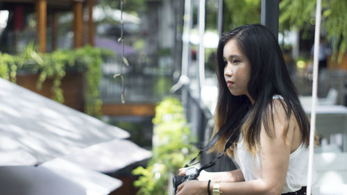 Beautiful young woman looking away