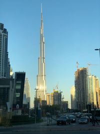 Modern buildings in city against clear sky