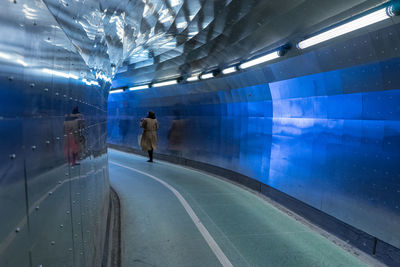 Man walking in tunnel