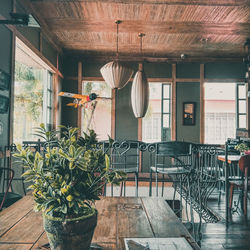 Empty chairs and tables in restaurant