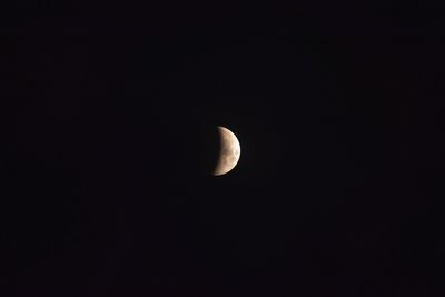 Low angle view of moon against sky at night