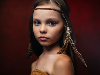 Close-up portrait of young woman looking away