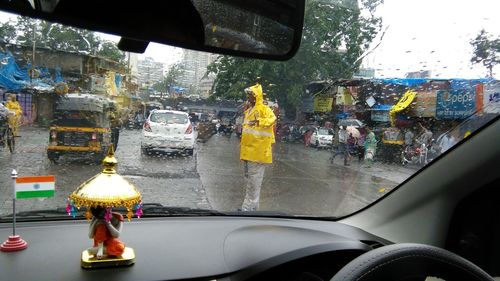 Man seen through car window