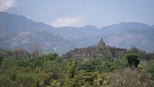 Castle on mountain against sky