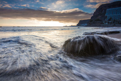 Scenic view of sea against cloudy sky