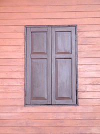 Closed wooden door of building