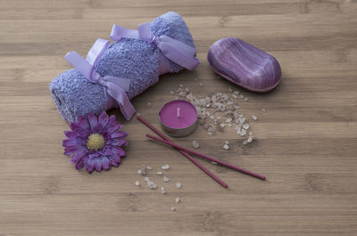 High angle view of spa treatment items on wooden table