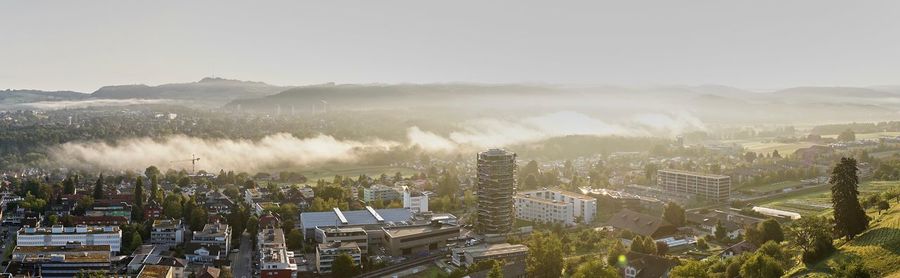 High angle view of buildings in city against sky