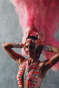 Full length portrait of smiling woman dancing