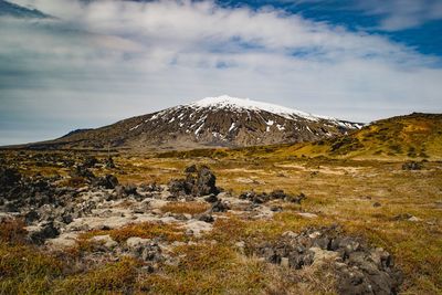 Scenic view of snowcapped mountains against sky