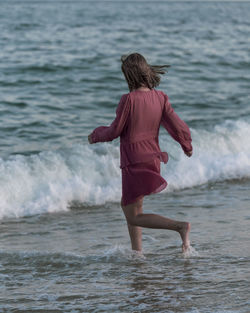 Rear view of woman on beach