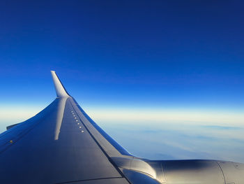 Cropped image of airplane wing