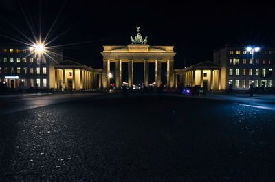 Brandenburg gate against sky at night