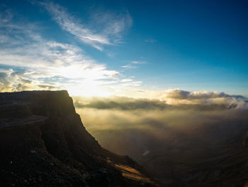 Scenic view of mountains against sky during sunset