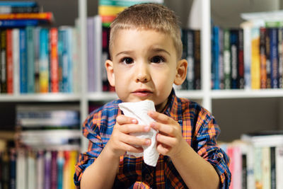 Portrait of boy holding ice cream