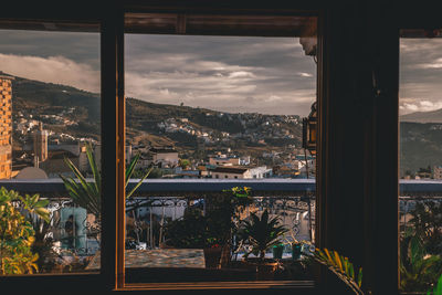 Cityscape seen through glass window