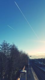 Vapor trail against clear blue sky