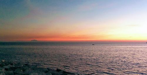 Scenic view of sea against sky at sunset