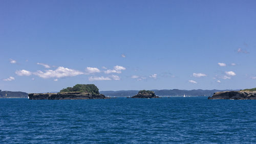 Scenic view of sea against blue sky