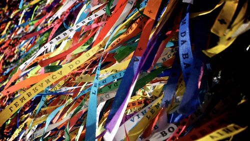 Low angle view of multi colored flags