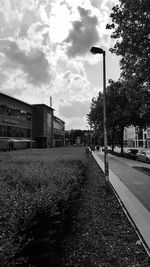 City street against cloudy sky