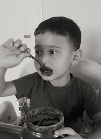 Portrait of boy holding camera