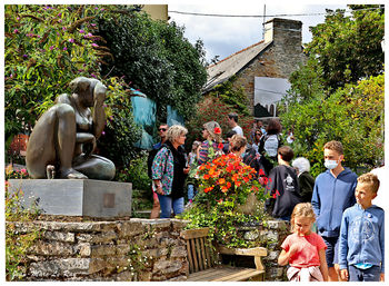 Group of people against plants