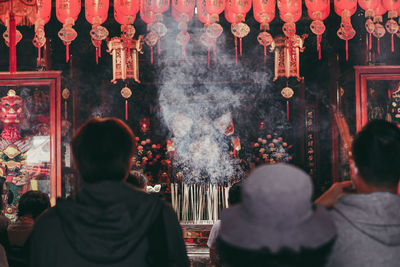 Rear view of people at temple