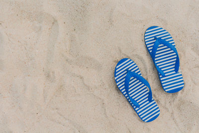 High angle view of shoes on sand