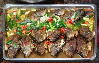High angle view of fish on barbecue grill