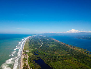 Scenic view of sea against blue sky