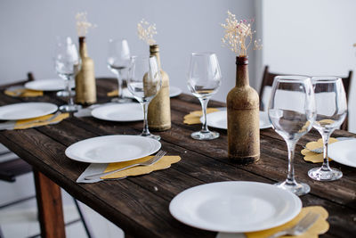 Festive table setting. beautiful dishes on a wooden table. stylish party decoration. tablescape